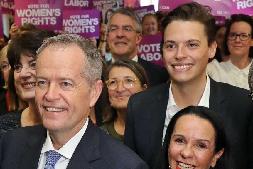 Bill Shorten stands in front of a crowd of Labor supporters including a young man, Luke Creasey, the candidate for Melbourne.
