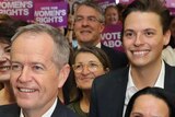 Bill Shorten stands in front of a crowd of Labor supporters including a young man, Luke Creasey, the candidate for Melbourne.