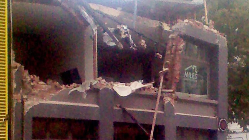 The facade of a building lies in ruins after an earthquake struck Christchurch