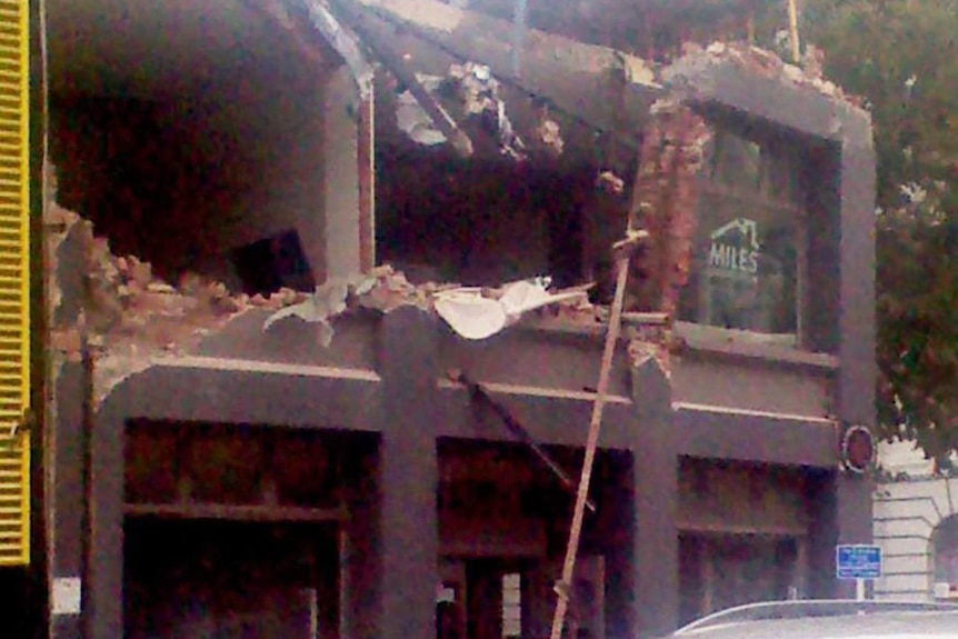 The facade of a building lies in ruins after an earthquake struck Christchurch