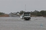 Drivers stranded as floods reach highway