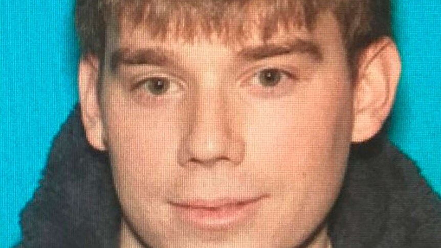 A head and shoulders shot of shooting suspect Travis Reinking.