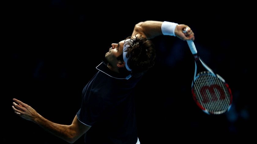 Roger Federer serves during the men's singles first round match against Fernando Verdasco