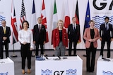 G7 foreign ministers stand for group photo.