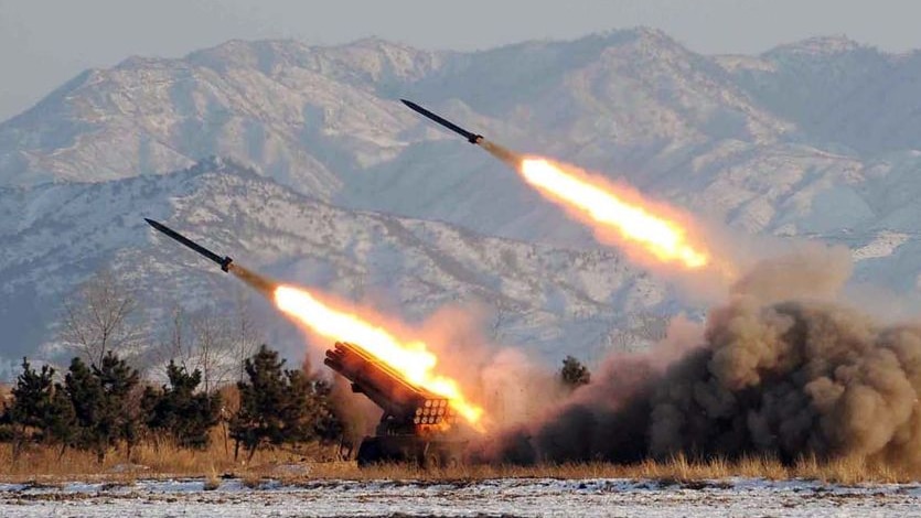 Two missiles take off at an undisclosed location in North Korea