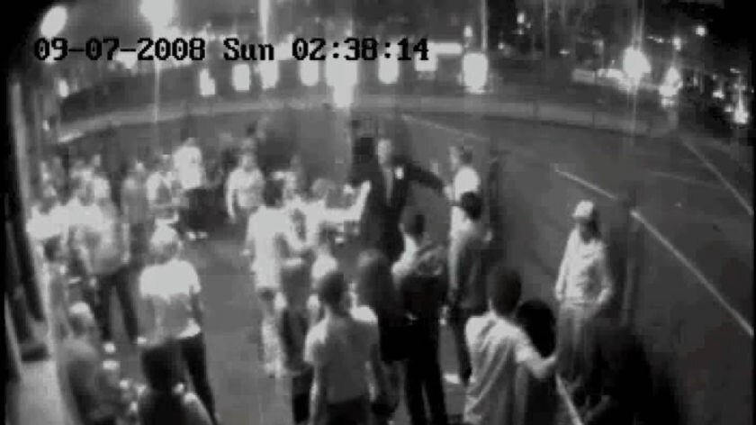 Security camera vision from QBH nightclub, showing a security guard breaking up the fight. Mr McEvoy lies on the ground.