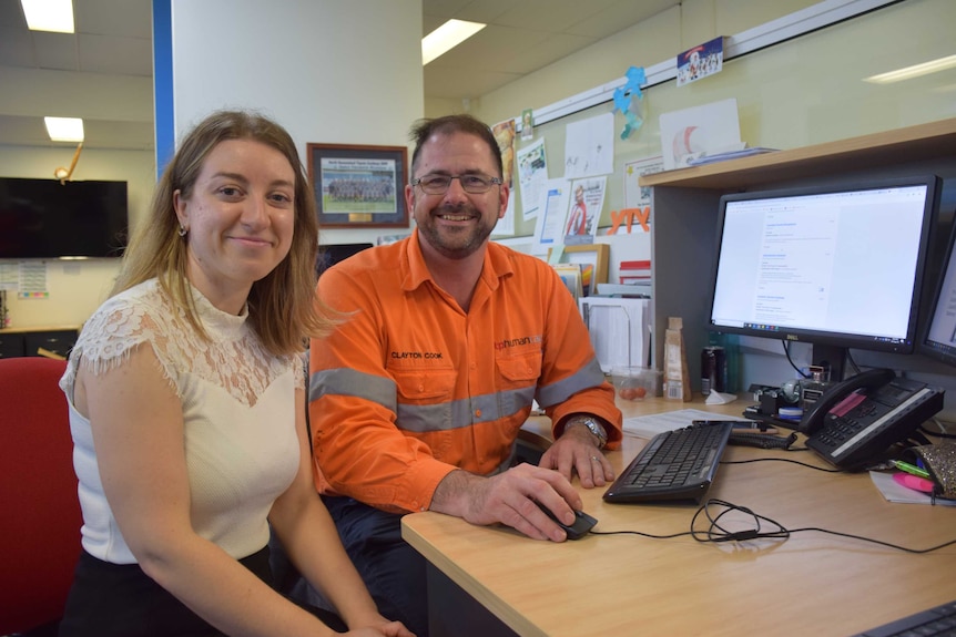 Townsville jobseeker Marina Stoianovski sitting at a desk with recruiter Clayton Cook.