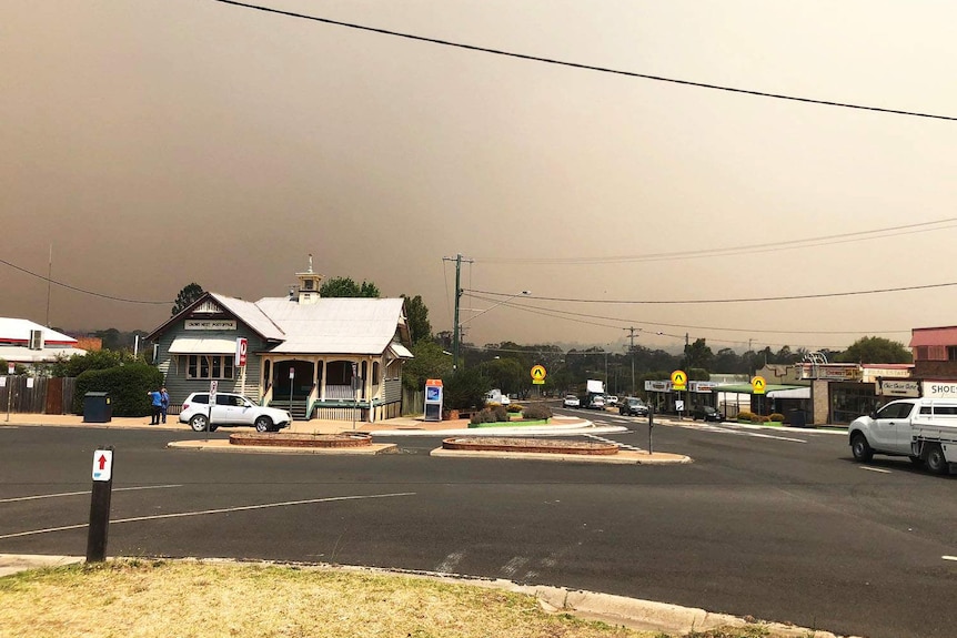 Bushfire smoke shrouds the sky and the town of Crows Nest near Toowoomba at midday.
