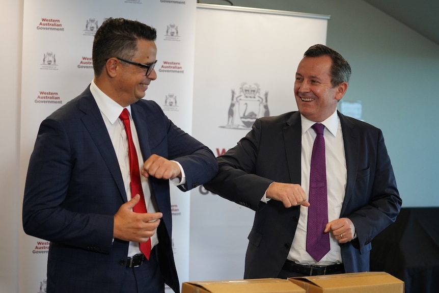 WA Treasurer Ben Wyatt and Premier Mark McGowan give each other an elbow bump