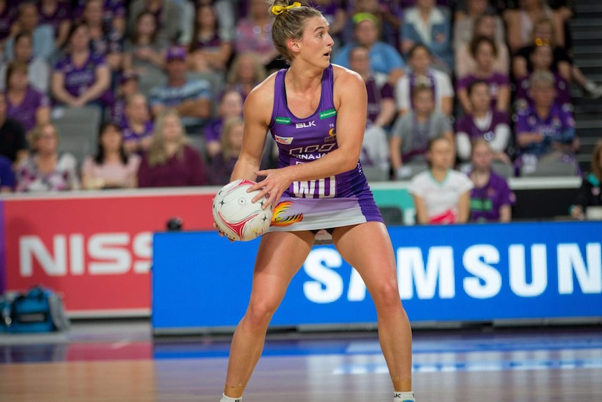 A member of the Queensland Firebirds netball team on the court