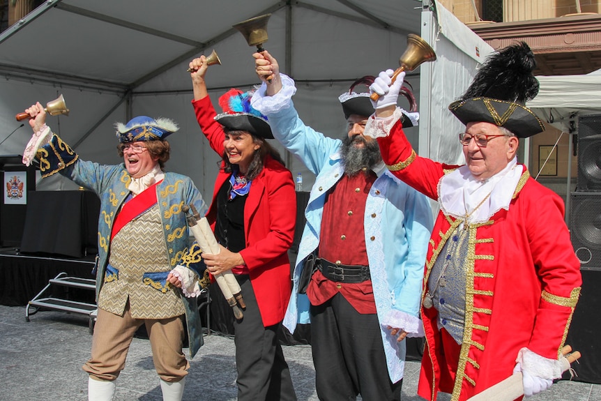 The four finalists line-up at the town crier competition in Brisbane.