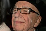 Rupert Murdoch (R) has apologised for his handling of the phone hacking scandal.