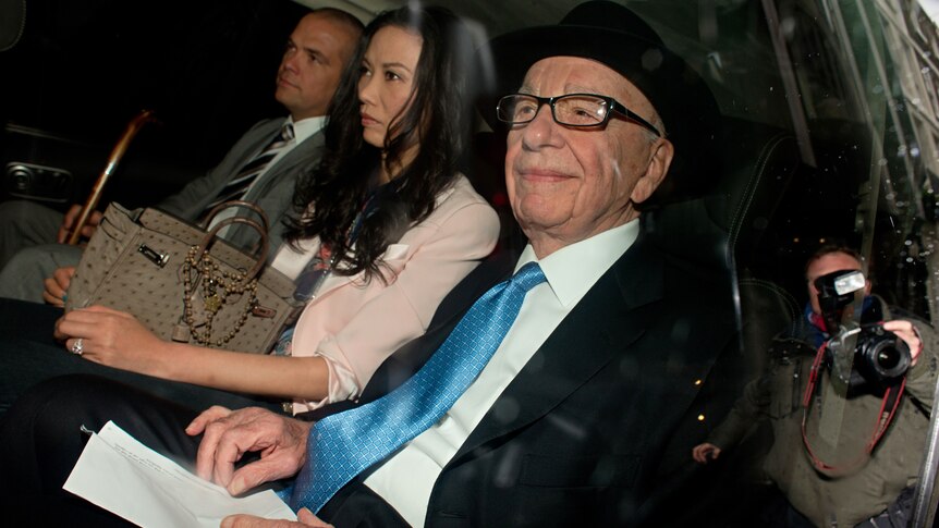 Rupert Murdoch (R) has apologised for his handling of the phone hacking scandal.