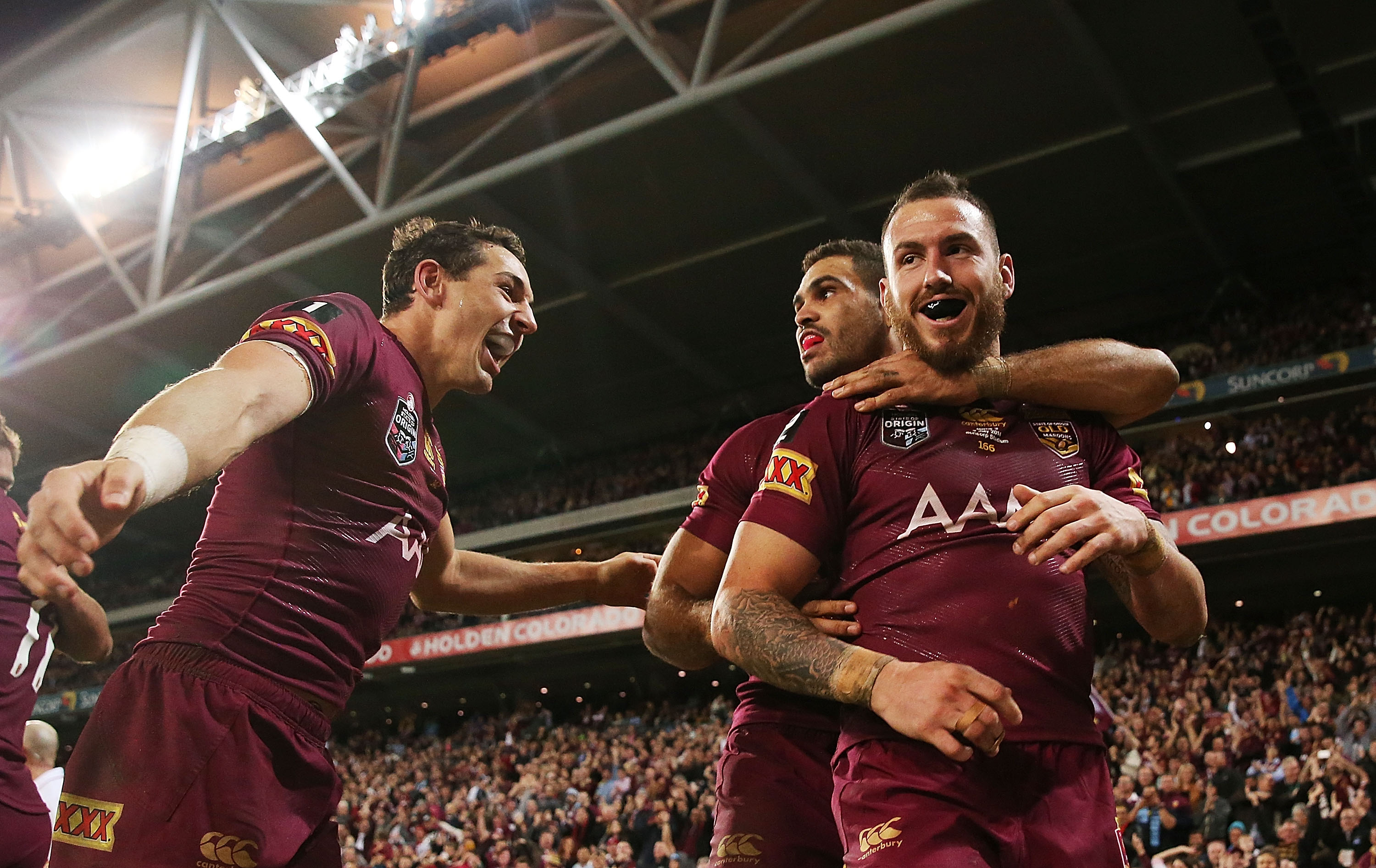 Billy Slater, Darius Boyd and Greg Inglis celebrate a try