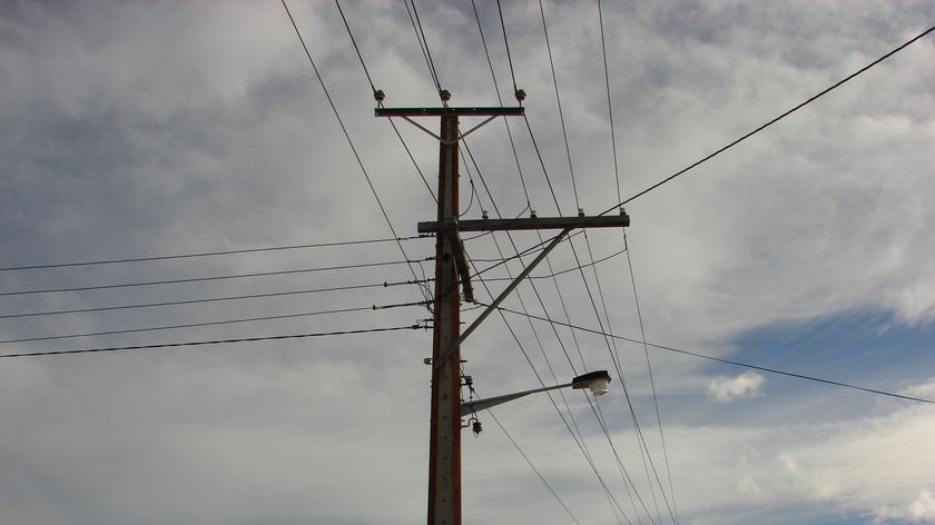 Power lines running between homes.