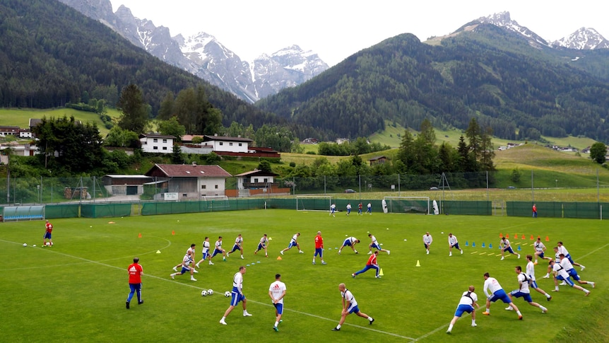 Russia's squad training with mountains in the background.