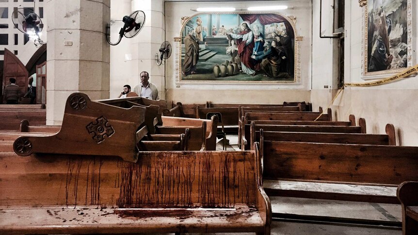 Blood stained pews inside the St George Church after a suicide bombing in the Nile Delta town of Tanta.