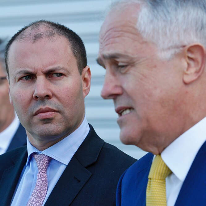 Josh Frydenberg looks at Malcolm Turnbull