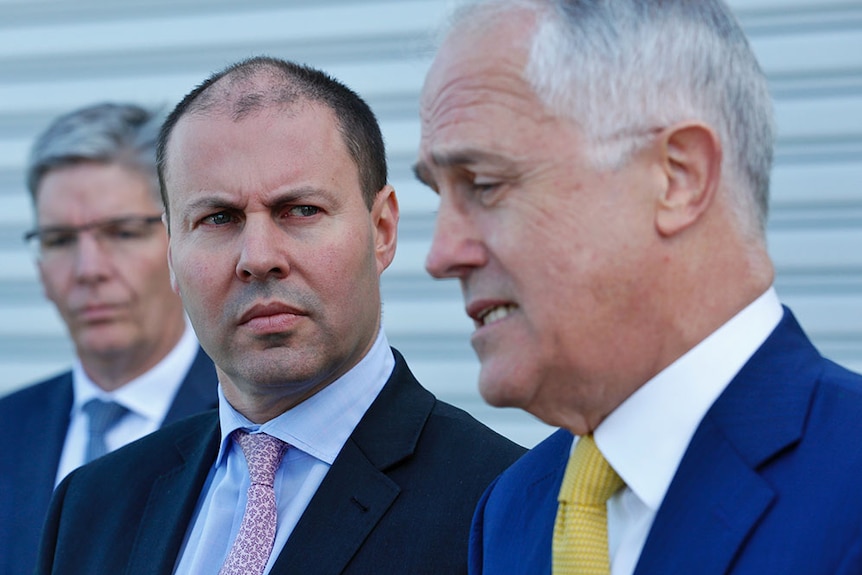 Josh Frydenberg looks at Malcolm Turnbull