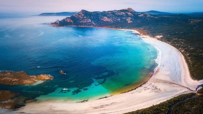 Aerial picture of a very picturesque bay with beautiful blue water on Flinders Island Tasmania