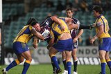 Losing skid over...Brett White gets smashed in a tackle in the Eels' first win in three rounds.