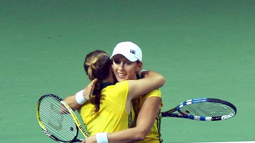 Gold medal hug in doubles