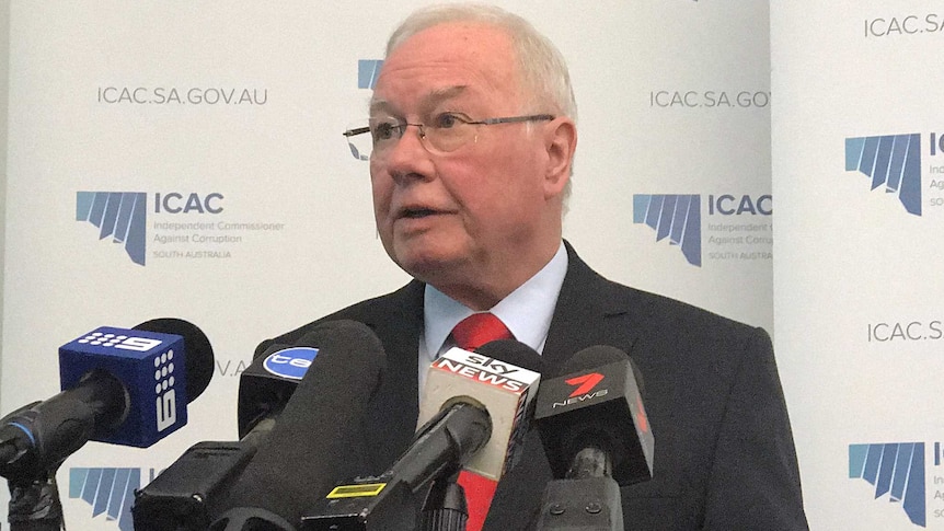 Bruce Lander speaks at a news conference in Adelaide.