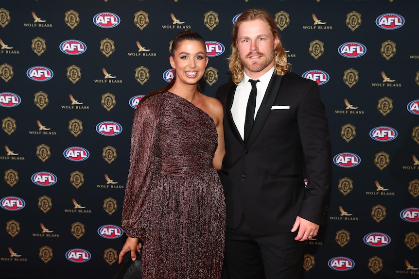 A Brisbane Lions player Daniel Rich and his wife Lauren at the Gabba for the Brownlow Medal ceremony.