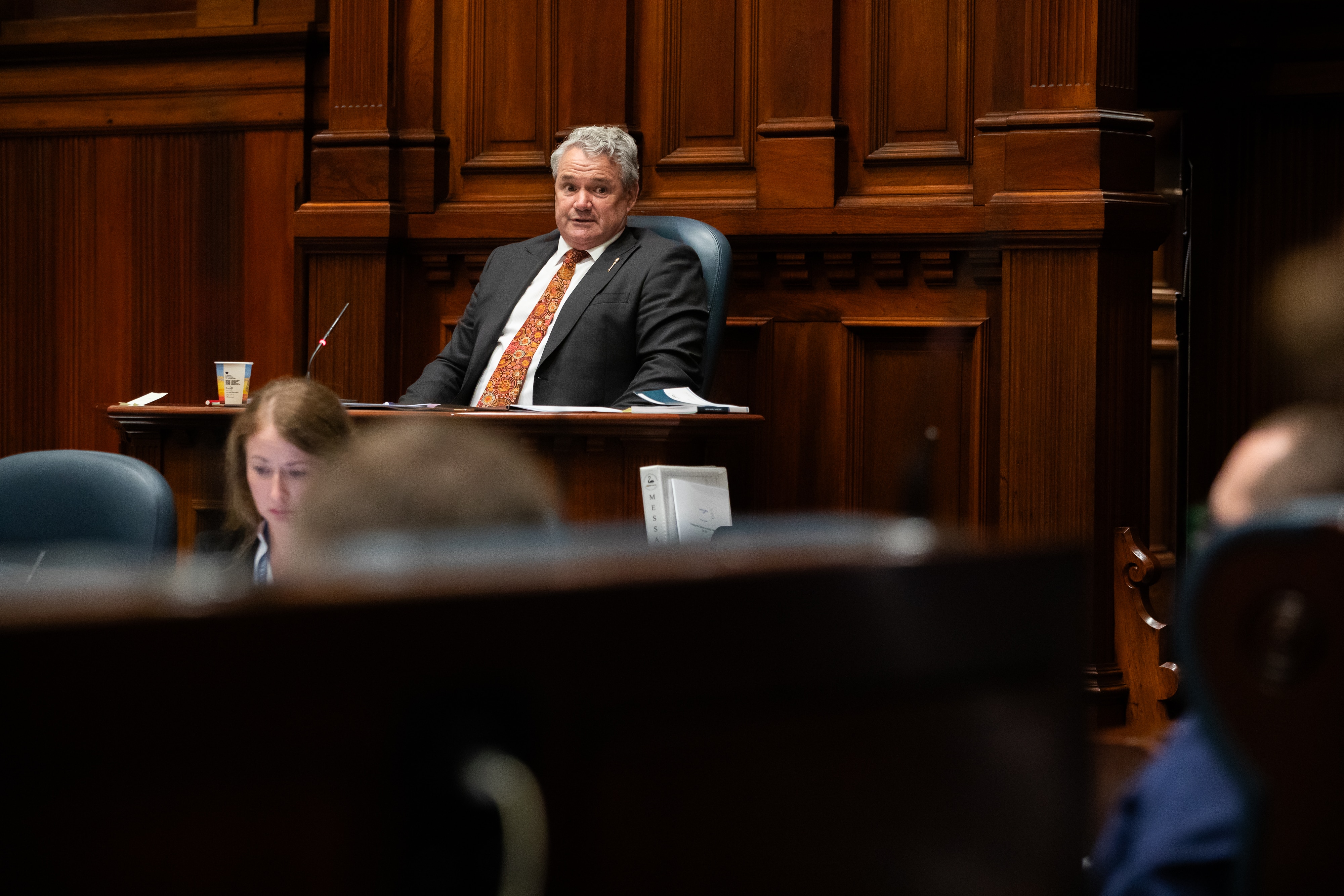 Stephen Price speaks to someone from the Speaker's Chair in Parliament.