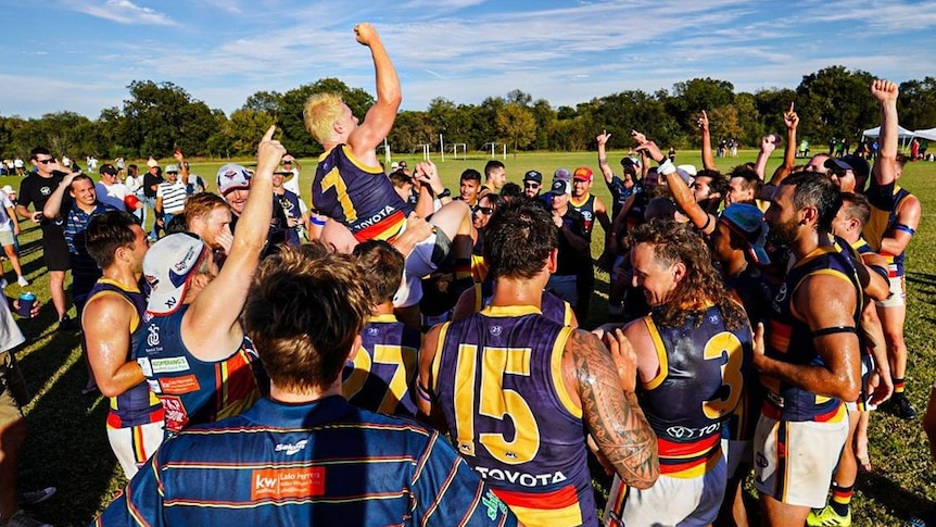 Austin Crows players celebrate their 2021 USAFL victory