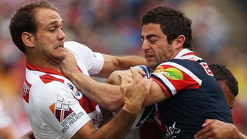 Hitting the wall ... Anthony Minichiello takes on the vaunted Dragons defence.