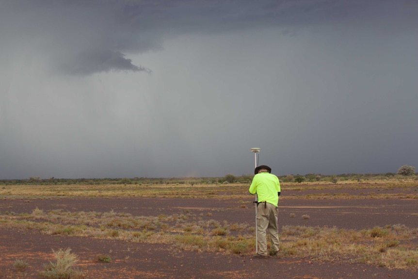 A man working on a remote airstrip as part of the upgrades