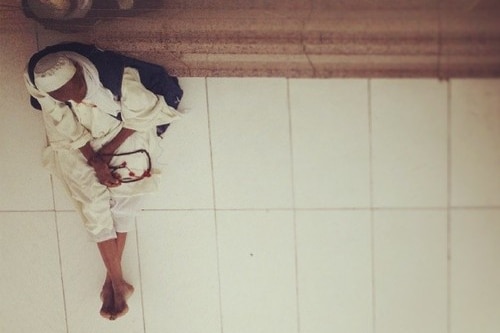 Man rests during Hajj