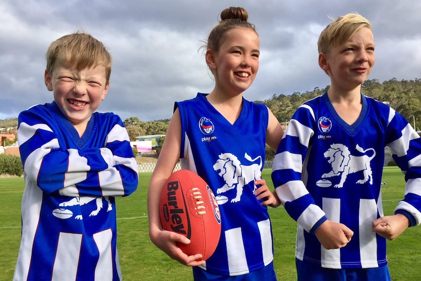 Young Australian Rules Football players Louis, Maisy and Mac Hammond.