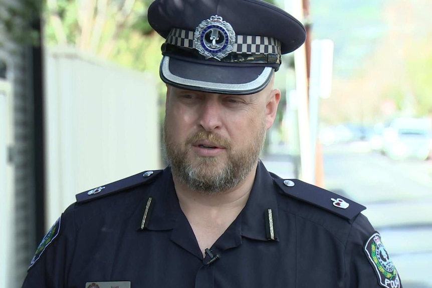 SA Police Detective Chief Inspector Scott Fitzgerald speaking to the media on a street in Kingswood