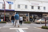 Three people cross the street in Maryborough, in central Victoria.
