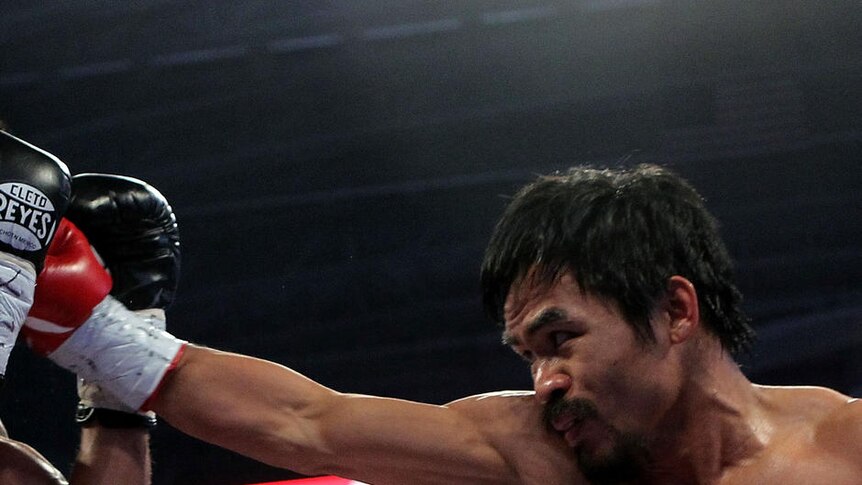 Manny Pacquiao lands a punch against Antonio Margarito en route to his 13th straight victory.