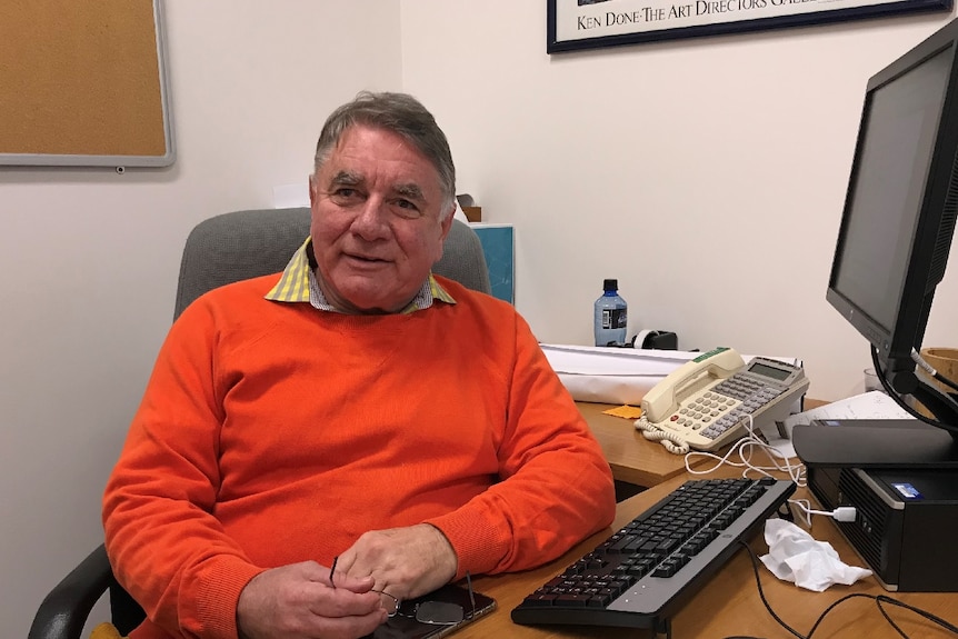 Professor Michael Chapman sits in his office