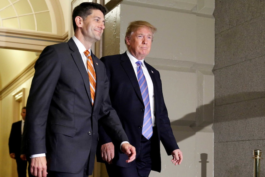Paul Ryan and Donald Trump walk together.