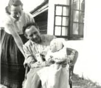Black and white photo of baby with mother and grandmother