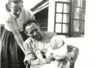 Black and white photo of baby with mother and grandmother