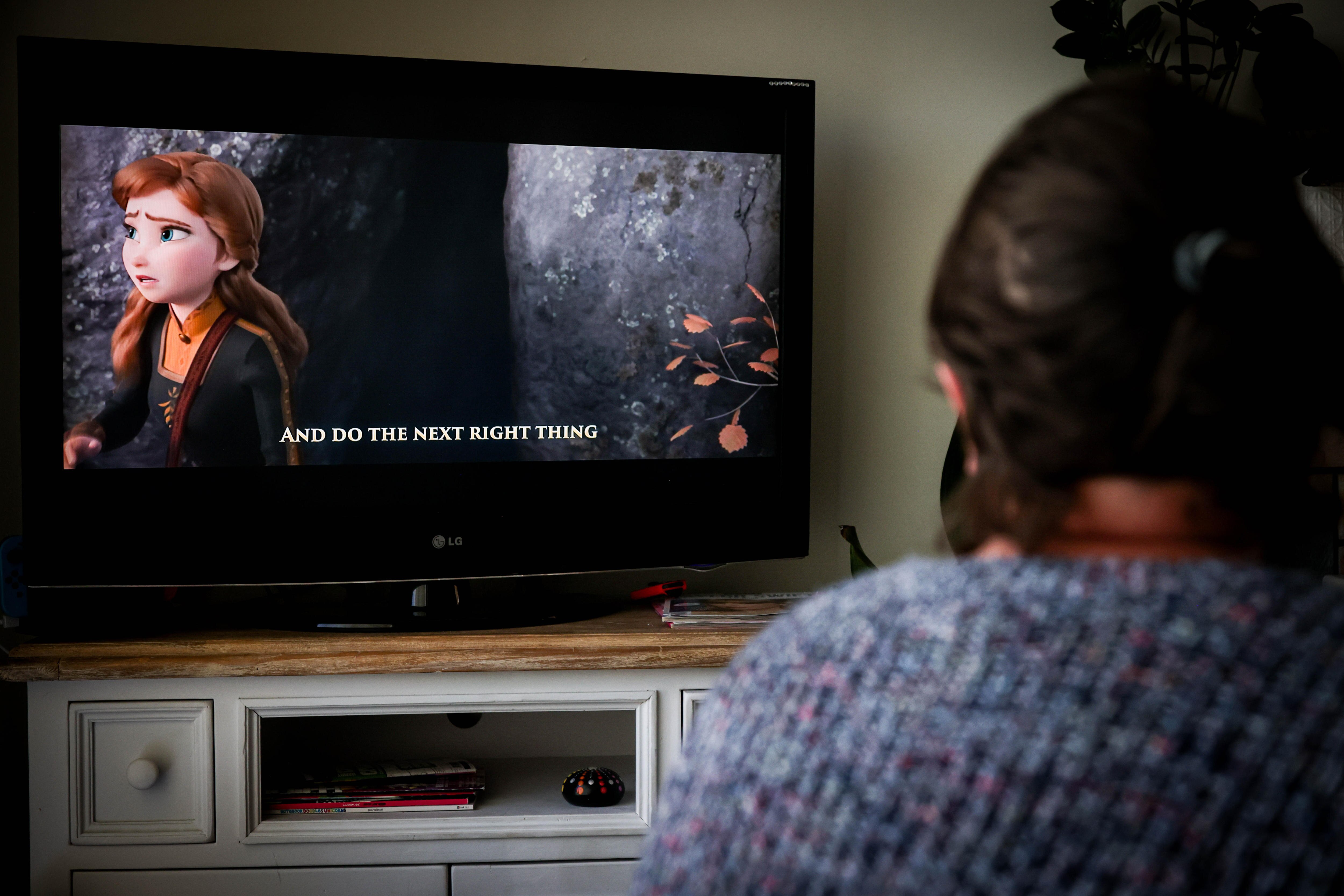 Ella watching the Disney animation, Frozen.