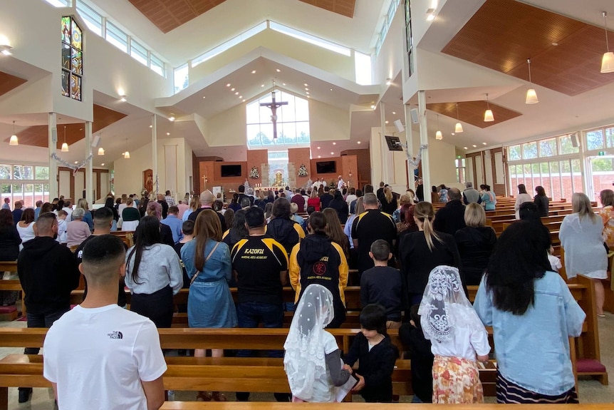 people praying in church