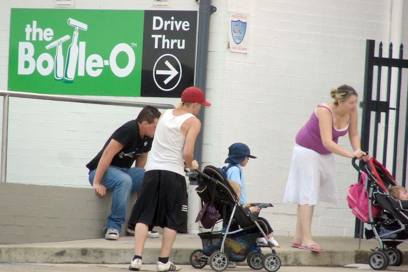 Families with kids in prams hang around outside the Bidwill Hotel in Sydney.