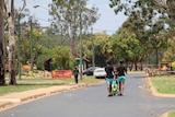 Locals walking along the main street of Woorabinda in central Queensland.