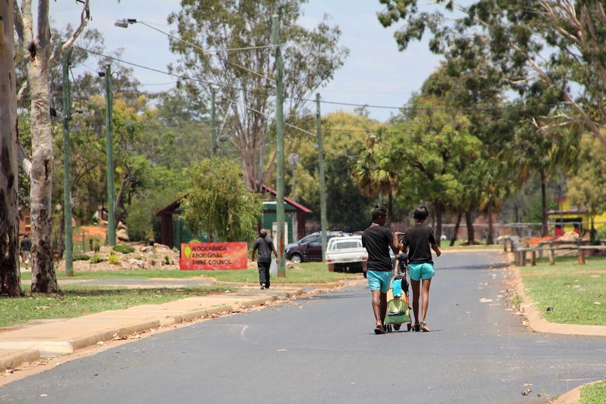 Locals walking along the main street of Woorabinda in central Queensland.