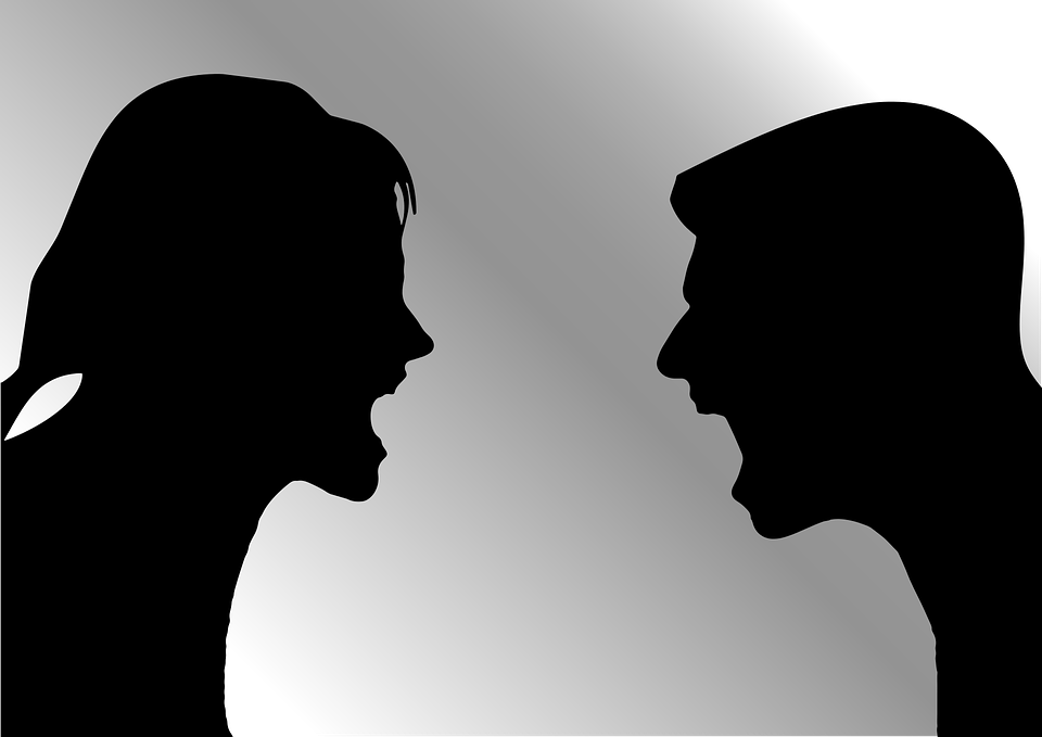 Silhouettes of a man and woman screaming