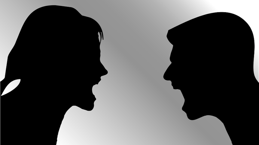 Silhouettes of a man and woman screaming