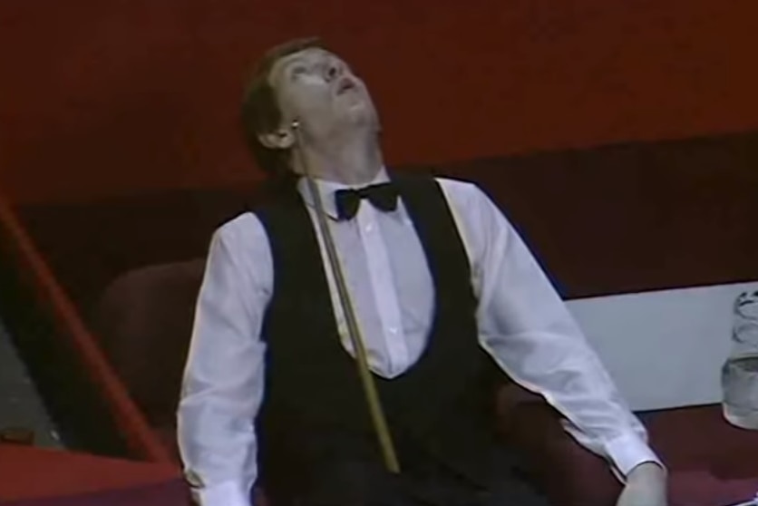 Steve Davis leans back in his chair and looks up at the ceiling.