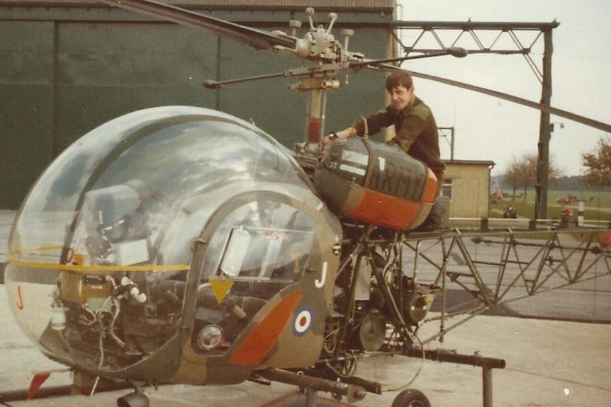 A young Alan Hatcher working on a British Army helicopter